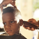 Illustration for article titled Hero Barber Gives Free Haircuts in Exchange For Kids Reading Him a Story